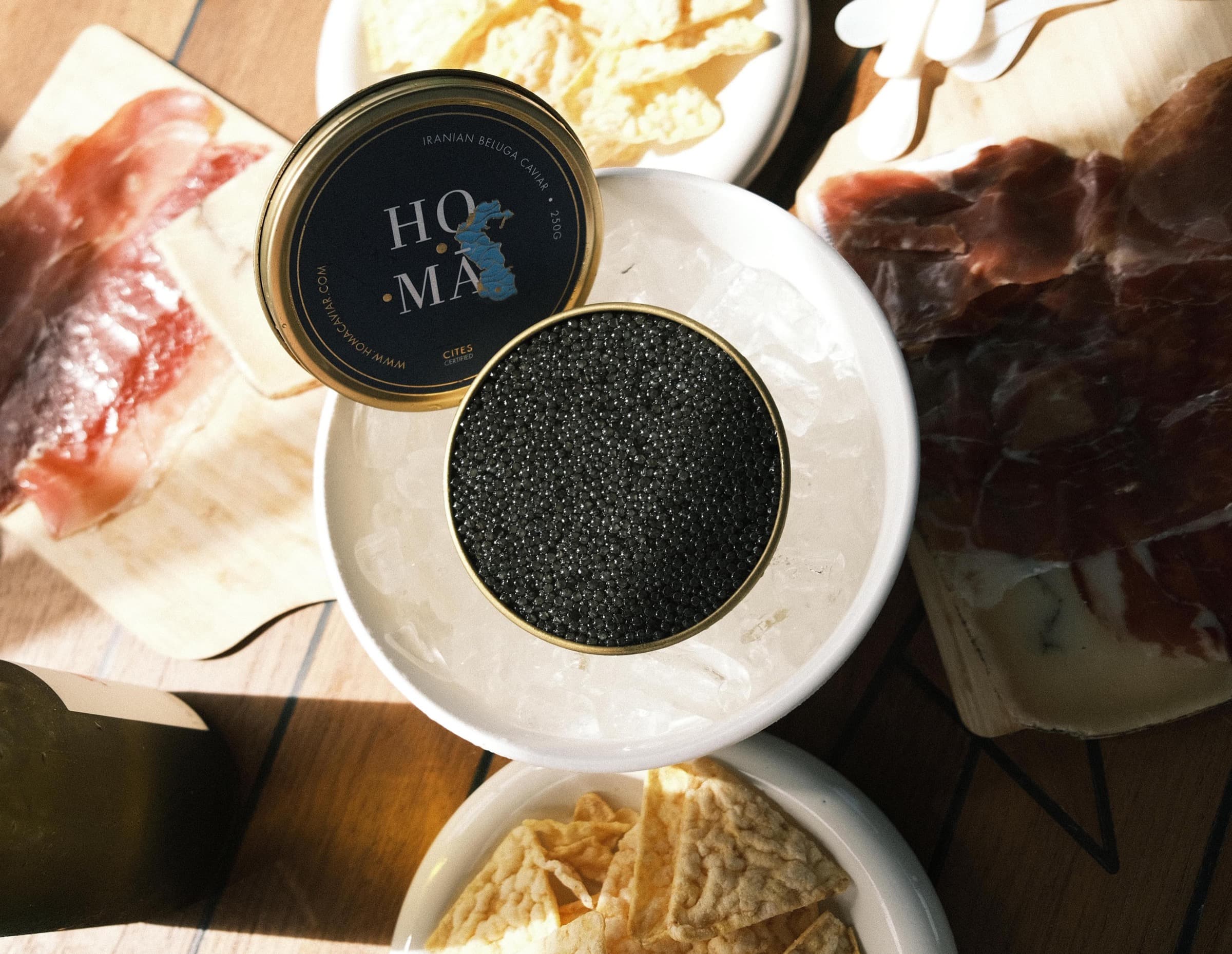 An intimate HOMA caviar tasting — caviar served alongside fine accompaniments