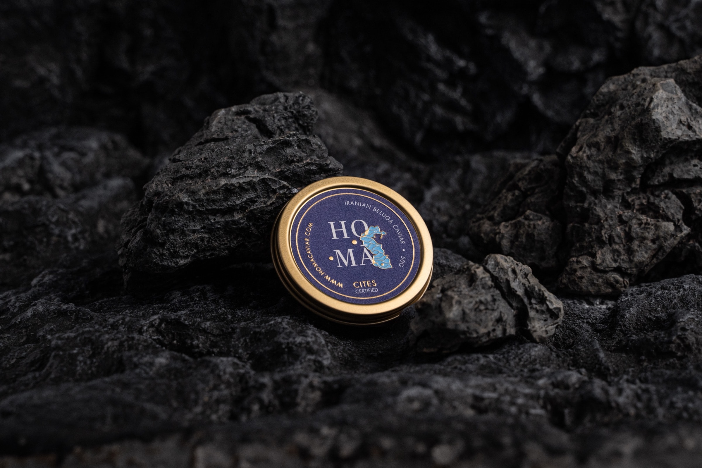 HOMA Beluga Caviar tin on volcanic rock